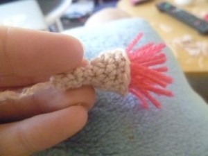 Trim the pink wool.